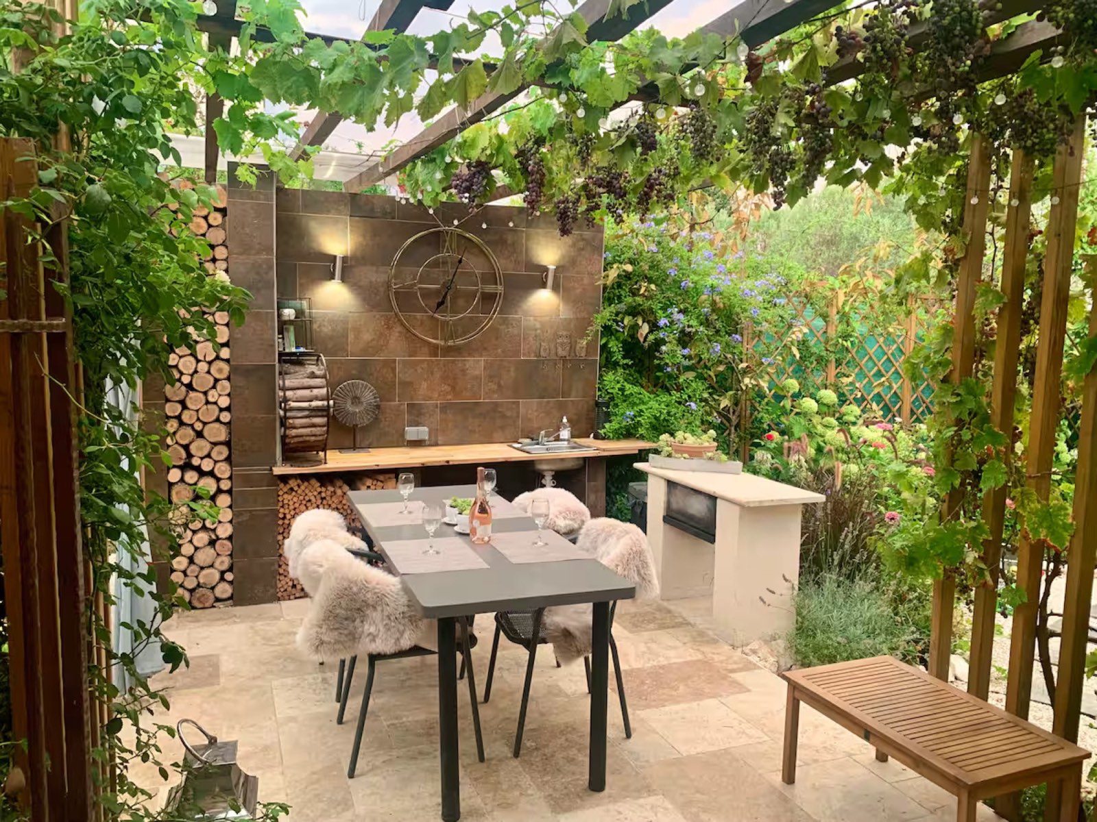 Outdoor dining pergola with grape vines
