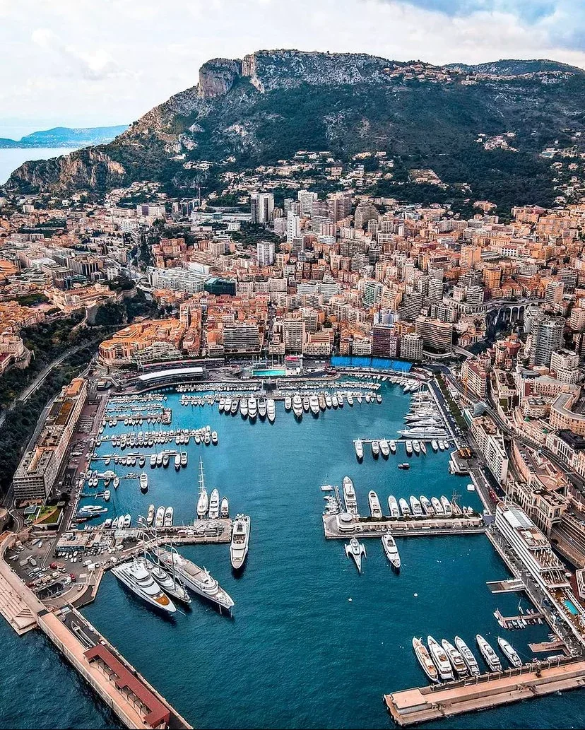 Aerial view of Monaco harbour with yachts, the city and surrounding hills